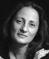Black and white portrait of a woman with soft expression.