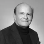 Black and white portrait of a man in a suit and turtleneck. Black and white portrait of a man in a suit and turtleneck.