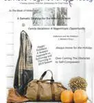 A stylish black and gold dress paired with a brown leather duffel bag and two pumpkins.