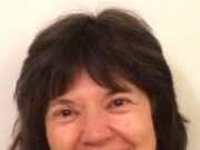 Embodying Embryology: Accessing Our Original Potential Smiling woman with dark hair and a necklace.
