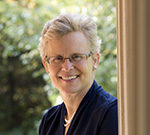 Four Ways to Click: Rewire Your Brain for Stronger, More Rewarding Relationships Smiling elderly woman with glasses outdoors near a column.
