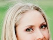 What Happened to Tiger’s Mojo? Close-up of a smiling blonde woman with green eyes.