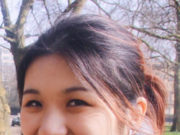 The Feeling Brain: The Biology and Psychology of Emotions A young woman smiling outdoors with trees in the background.