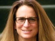 8 Keys to Parenting Children with ADHD A woman with long blonde hair and glasses smiling.