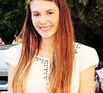 The Intelligent Body: Reversing Chronic Fatigue and Pain from the Inside Out Smiling woman with long hair outdoors.
