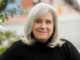 Clinical Applications of the Polyvagal Theory: A Reflection Close up of smiling woman in black sweater