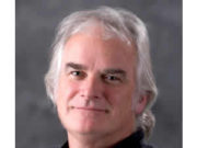 Barnaby B. Barratt, PhD, DHS, ABPP Portrait of a middle-aged man with gray hair in a black shirt.