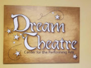 Dream Theater, Inc. Dream Theatre logo with stars on a beige background.