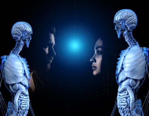 Salutogenesis and Well-Being Two human faces facing each other with two skeletal figures on their sides under blue light.